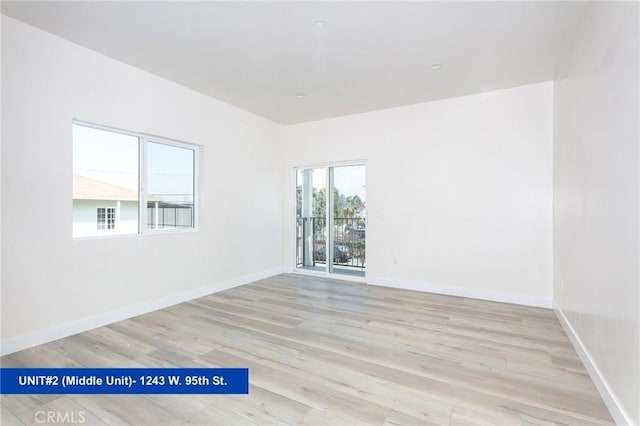 empty room with light hardwood / wood-style floors