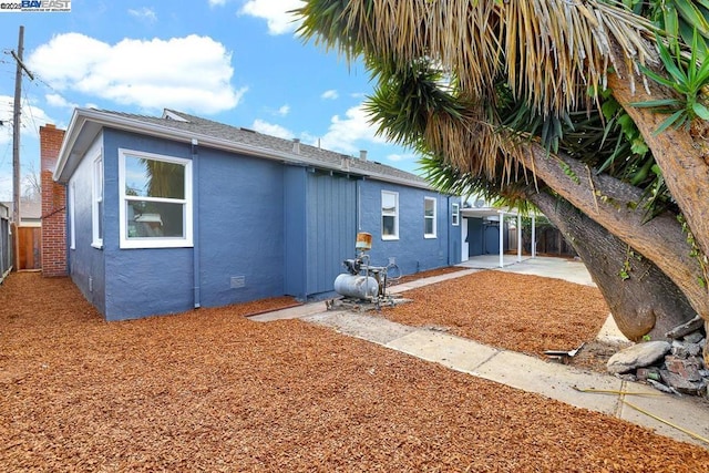 back of property featuring a patio area