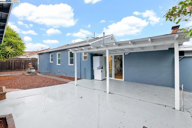 rear view of property featuring a patio