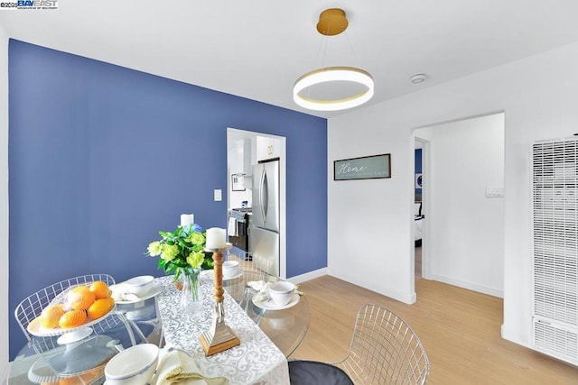 dining area with light hardwood / wood-style flooring