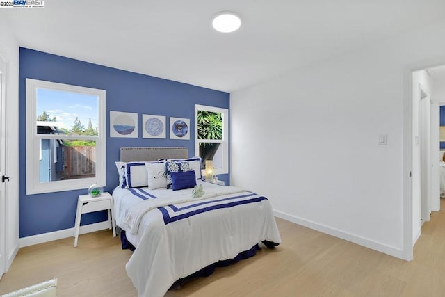 bedroom featuring light wood-type flooring