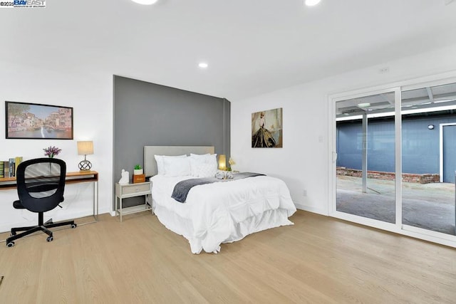 bedroom featuring access to outside and light wood-type flooring