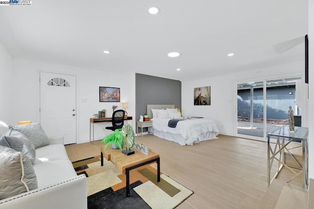 bedroom featuring light hardwood / wood-style floors and access to outside