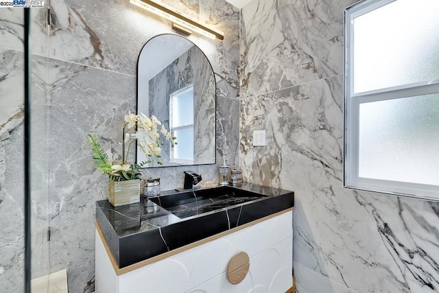 bathroom with vanity and a wealth of natural light