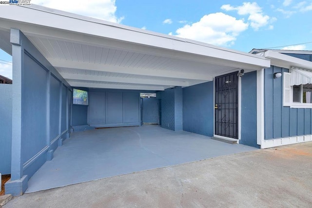 exterior space with a carport