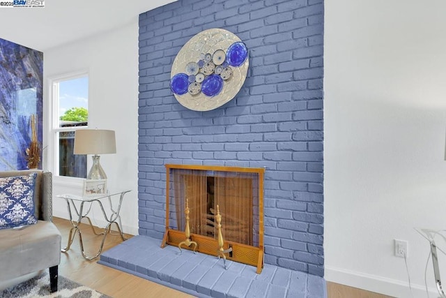 interior details with hardwood / wood-style floors and a fireplace