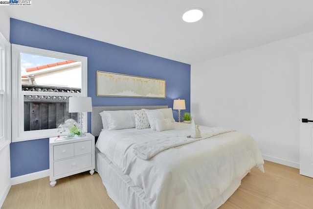 bedroom featuring light wood-type flooring