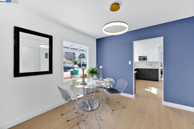 dining area with light hardwood / wood-style floors