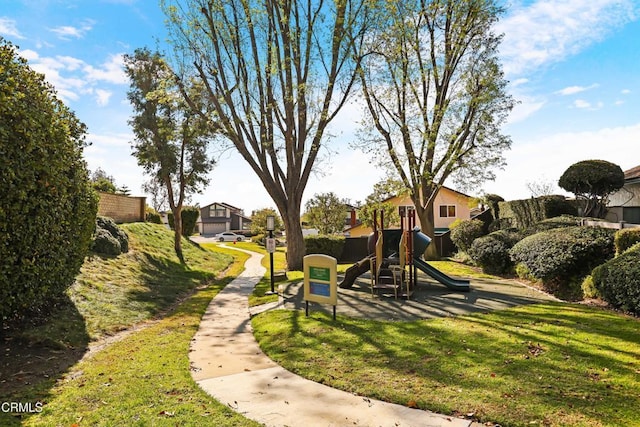 view of jungle gym featuring a lawn