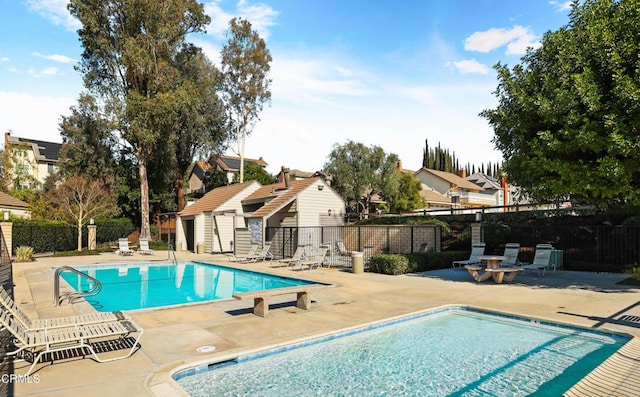 view of swimming pool featuring a patio