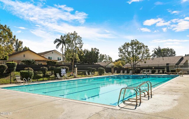 view of swimming pool with a patio area