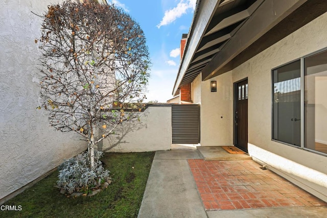 property entrance with a patio