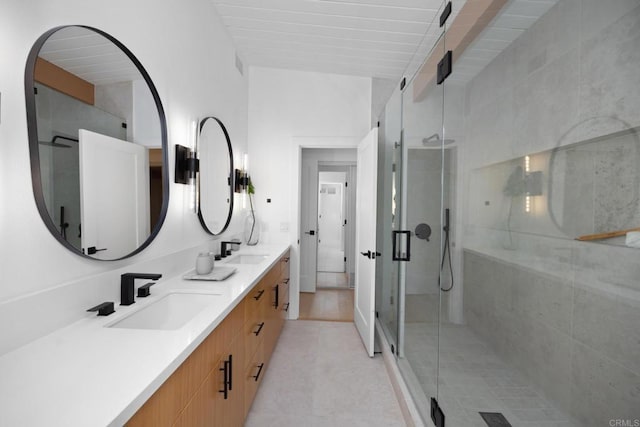 bathroom with vanity and an enclosed shower