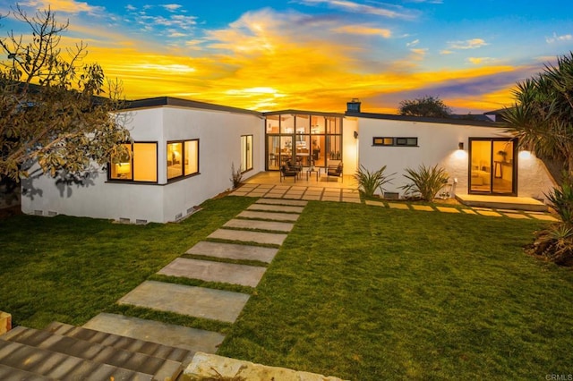 exterior space featuring a yard and a patio