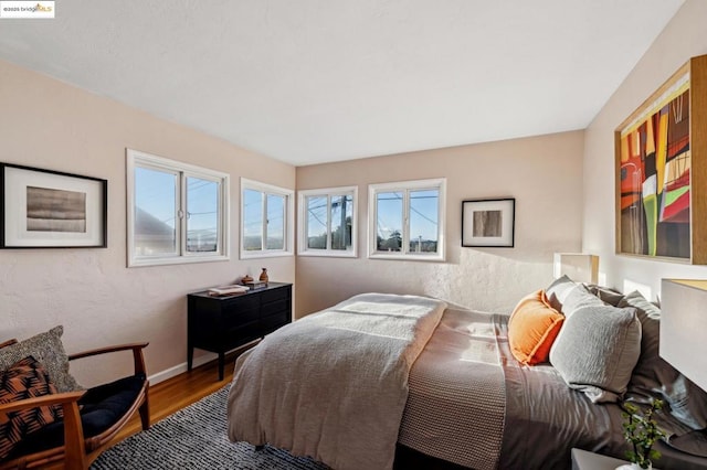 bedroom with hardwood / wood-style flooring