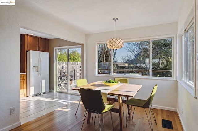 dining area with light wood-type flooring