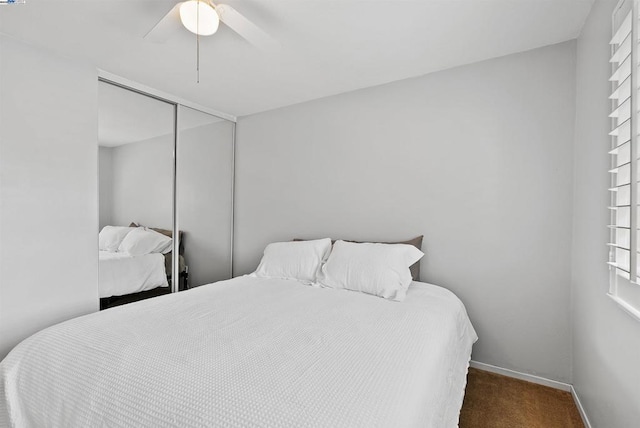 bedroom featuring ceiling fan, carpet flooring, and a closet