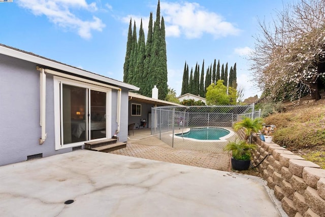 view of patio with a fenced in pool