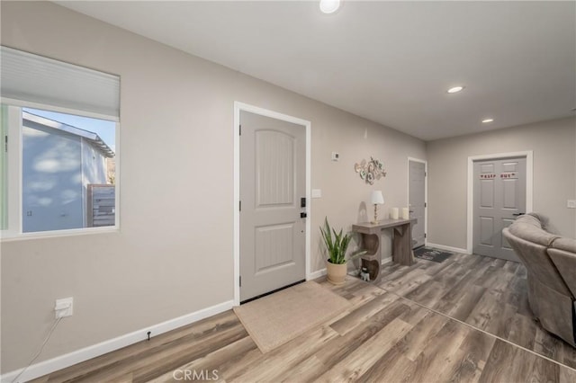 entryway with hardwood / wood-style flooring