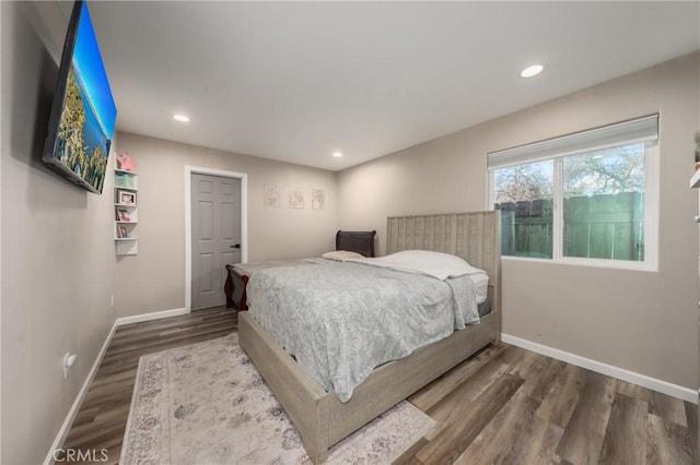 bedroom featuring dark hardwood / wood-style flooring