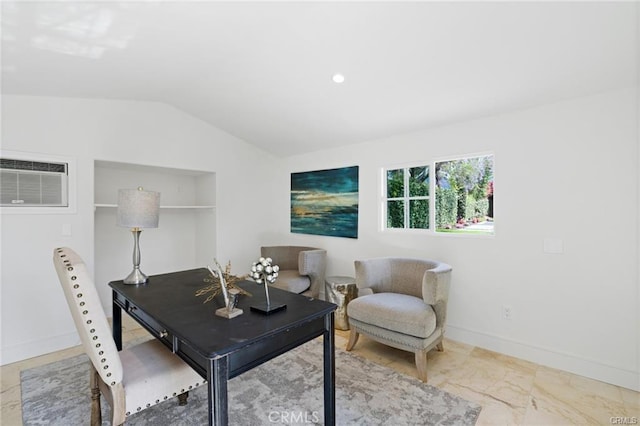 office area with vaulted ceiling and an AC wall unit