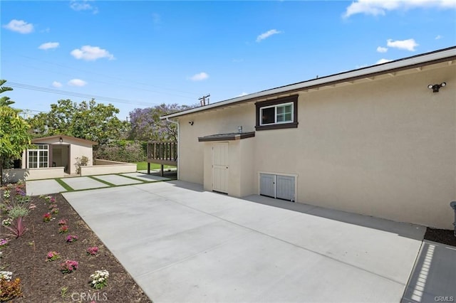 view of patio / terrace featuring a storage shed