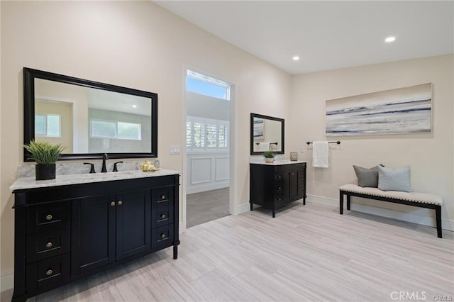 bathroom with hardwood / wood-style flooring and vanity