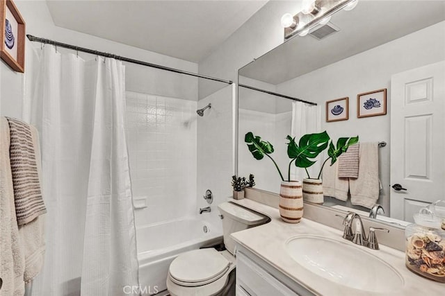 full bathroom featuring shower / tub combo, vanity, and toilet