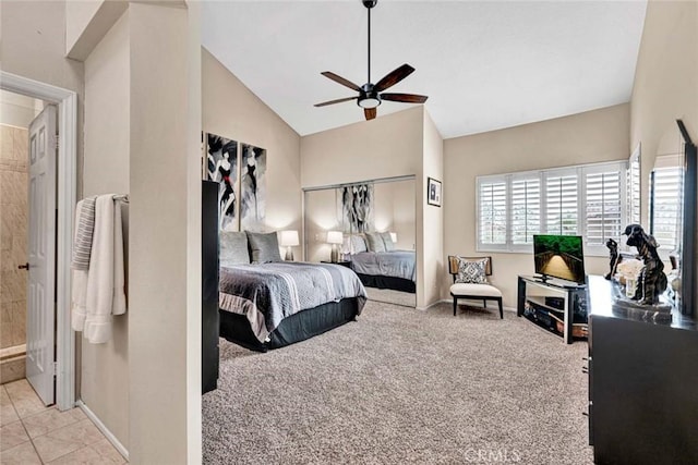 carpeted bedroom featuring vaulted ceiling and ceiling fan