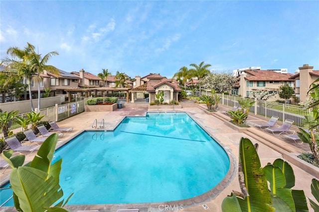 view of swimming pool with a patio