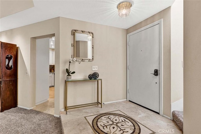 view of carpeted foyer