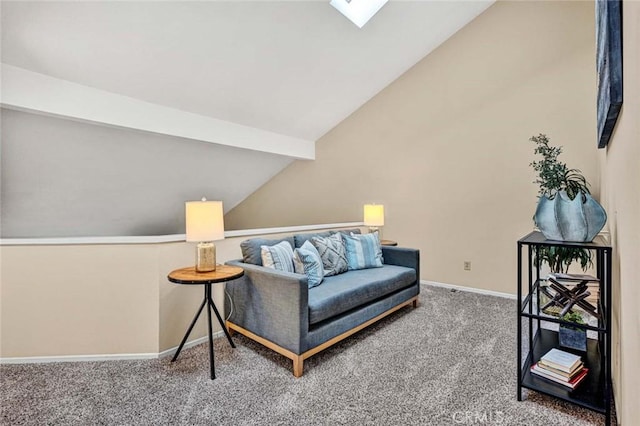 sitting room with vaulted ceiling with beams and carpet