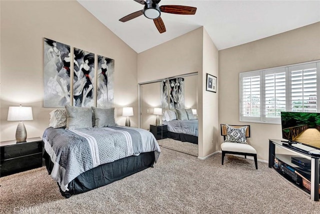 carpeted bedroom featuring lofted ceiling and ceiling fan