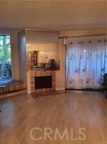 unfurnished living room with hardwood / wood-style floors