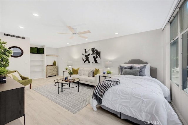 bedroom featuring ceiling fan, access to exterior, and light hardwood / wood-style floors