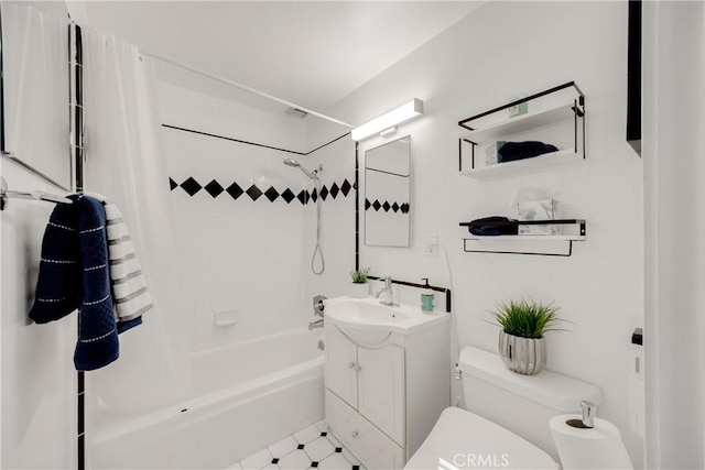 full bathroom featuring vanity, toilet, and tiled shower / bath combo