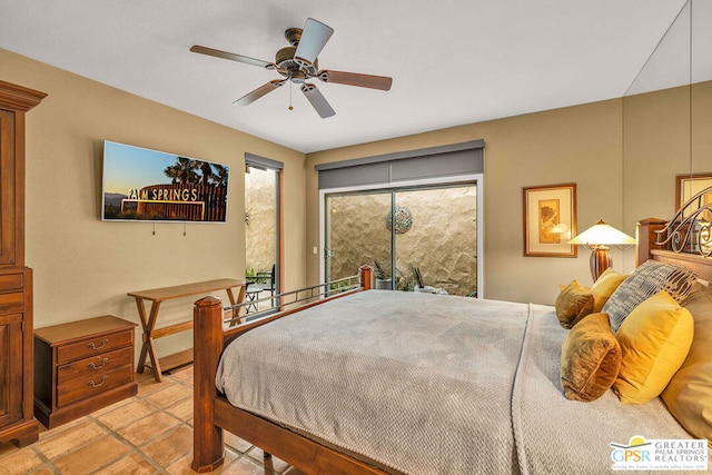 bedroom with access to exterior and ceiling fan