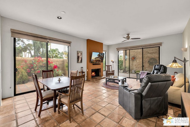 dining space featuring ceiling fan and plenty of natural light