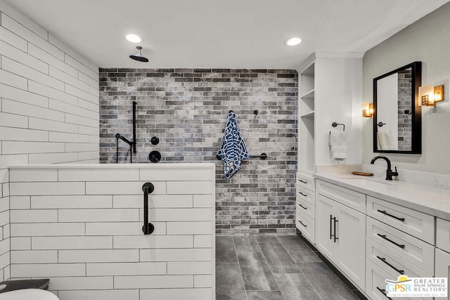 bathroom featuring vanity and a shower