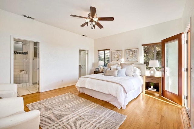 bedroom with visible vents, baseboards, ceiling fan, and light wood finished floors