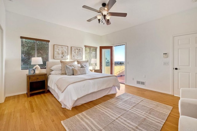 bedroom with a ceiling fan, visible vents, baseboards, access to outside, and light wood-type flooring