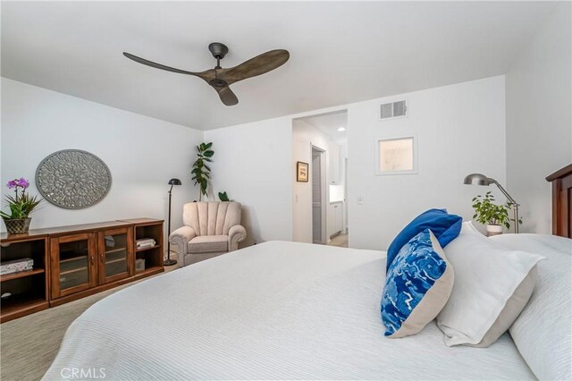 carpeted bedroom with ceiling fan