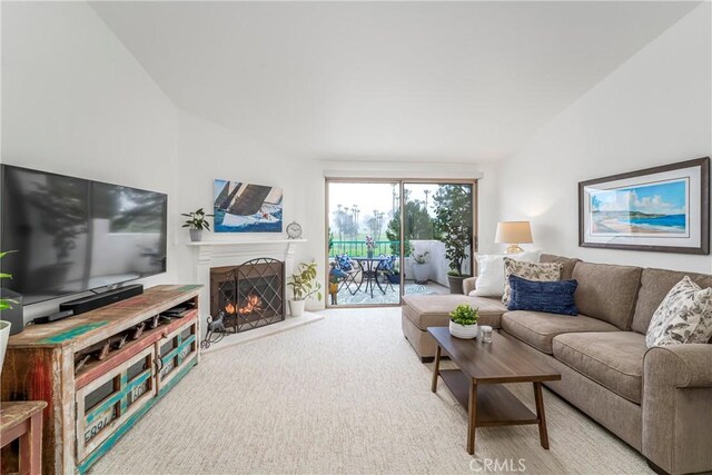 living room with lofted ceiling and carpet