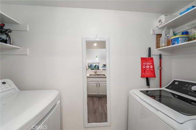 laundry room featuring sink and washing machine and clothes dryer