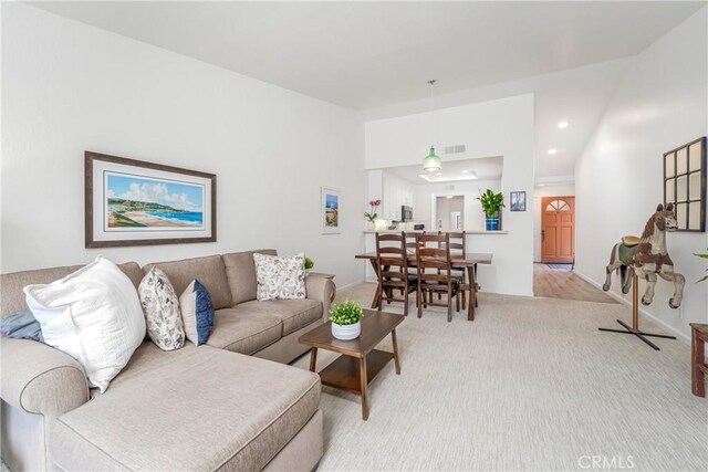 living room with light colored carpet