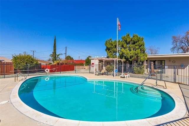 view of swimming pool with a patio