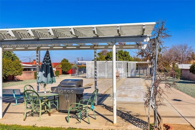 view of patio featuring a grill and a pergola