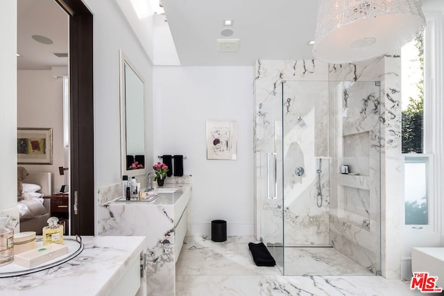 bathroom with vanity and a shower with door