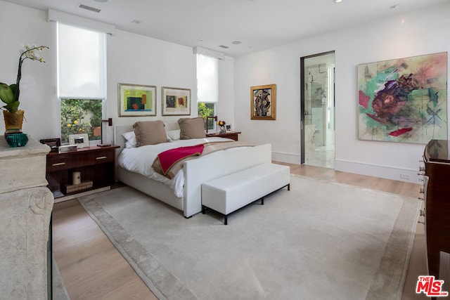 bedroom with light hardwood / wood-style floors