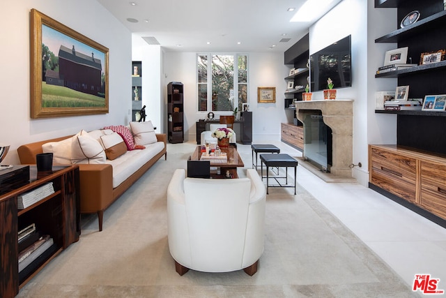 living room featuring light tile patterned floors and a fireplace